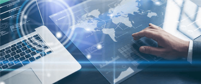 laptop keyboard and hand over world map global coverage