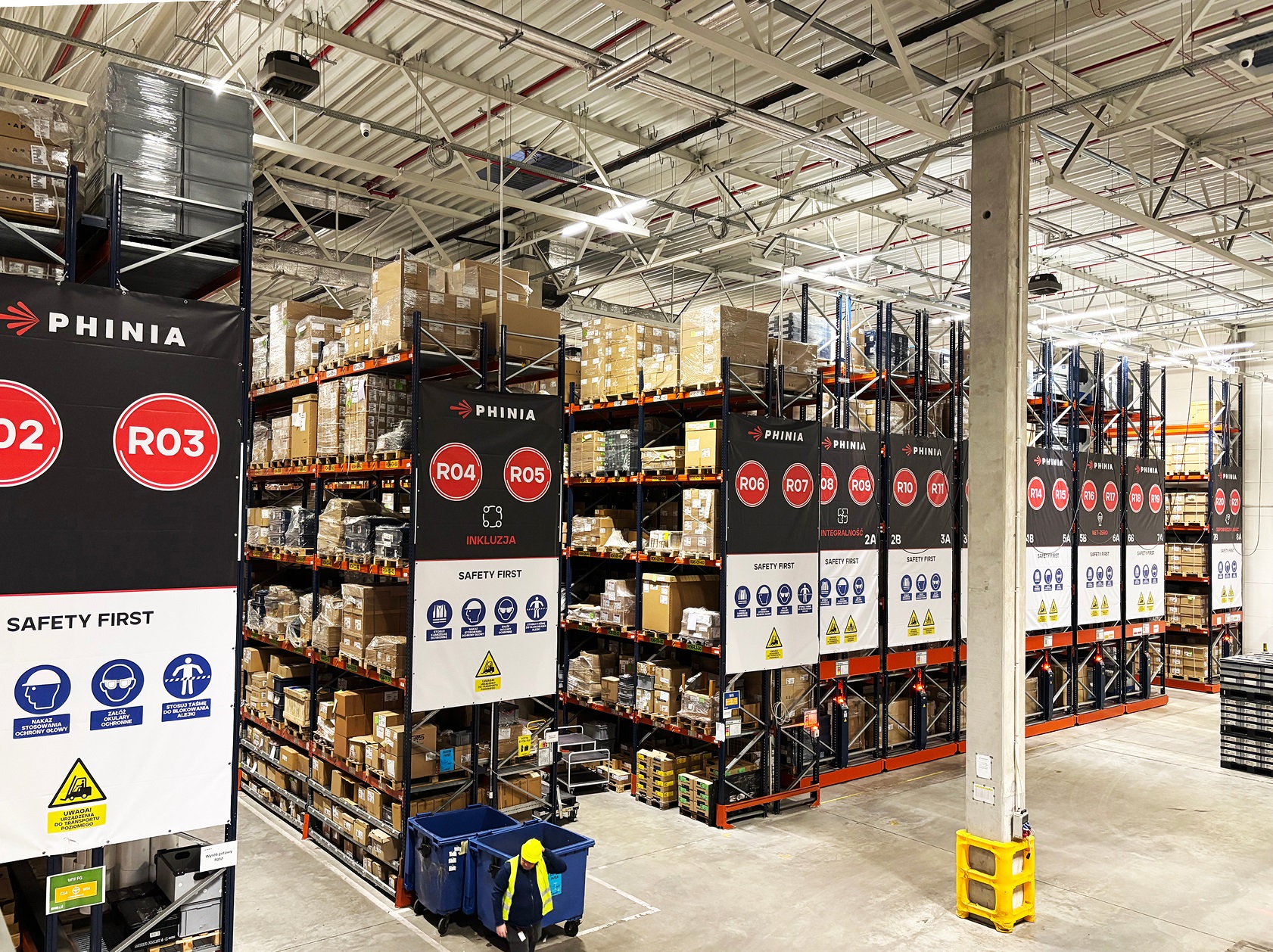 Interior of a PHINIA warehouse and distribution facility with organised storage racks.